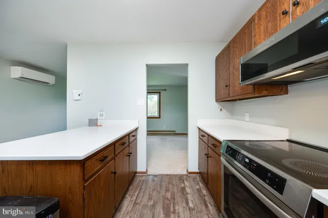 a kitchen that has a sink and a stove