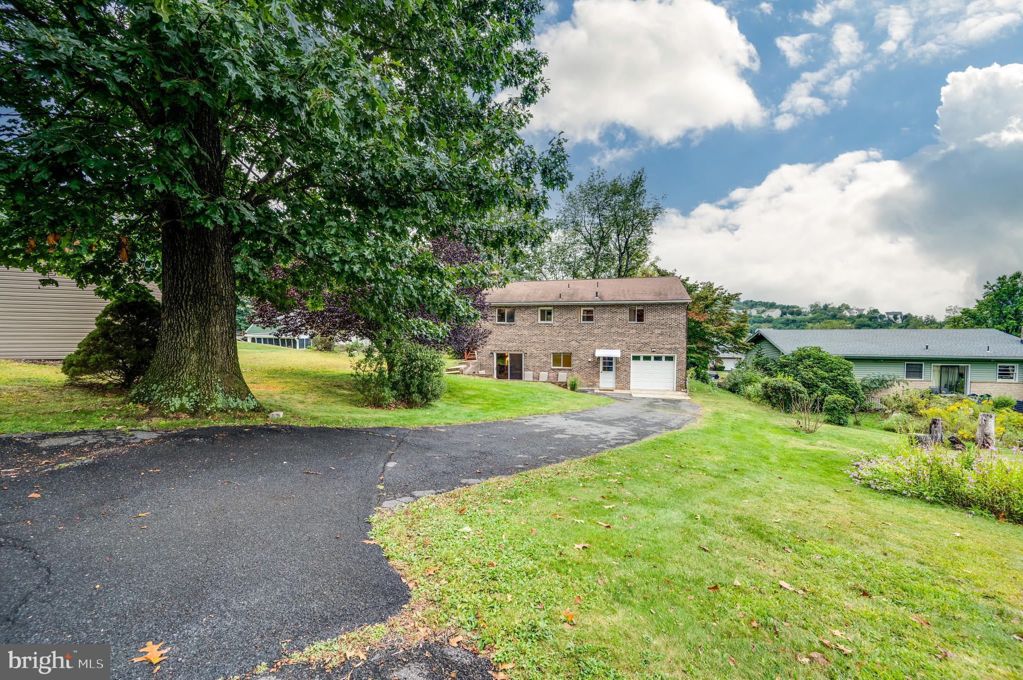 1029 Crestview Avenue Reading, PA 19607 - Photo 38 of 44 a view of a house with yard and a garden