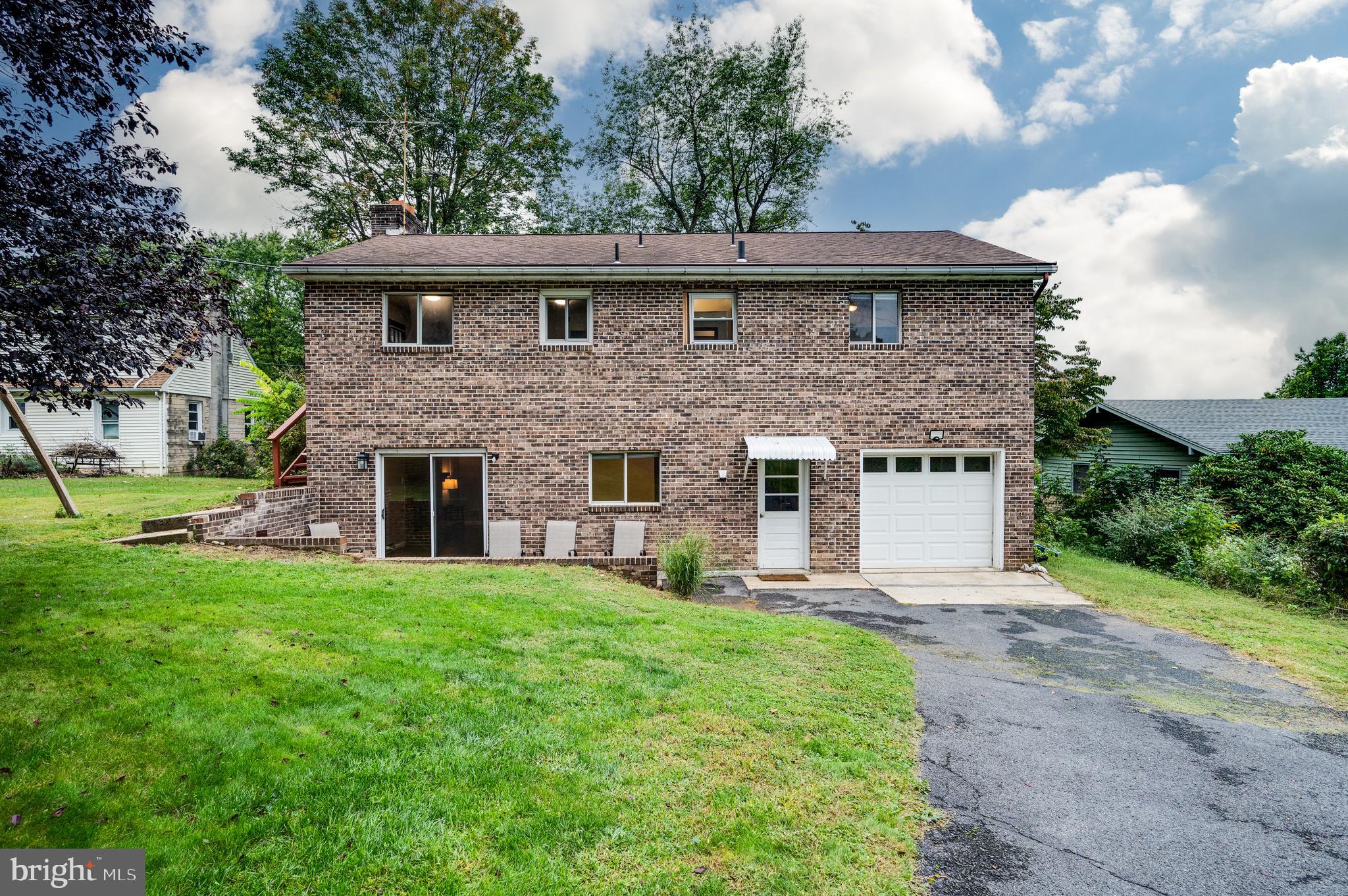1029 Crestview Avenue Reading, PA 19607 - Photo 40 of 44 a front view of a house with a garden