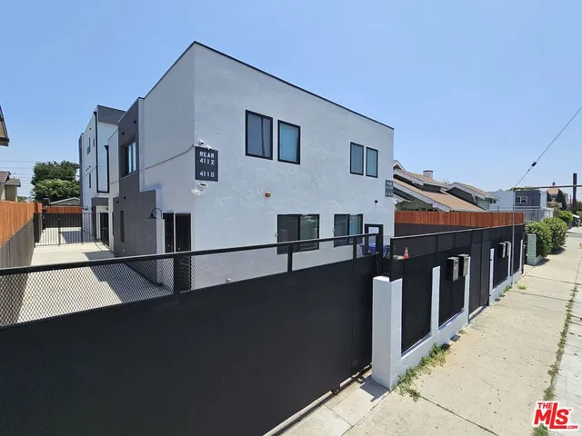 a front view of a house with a street