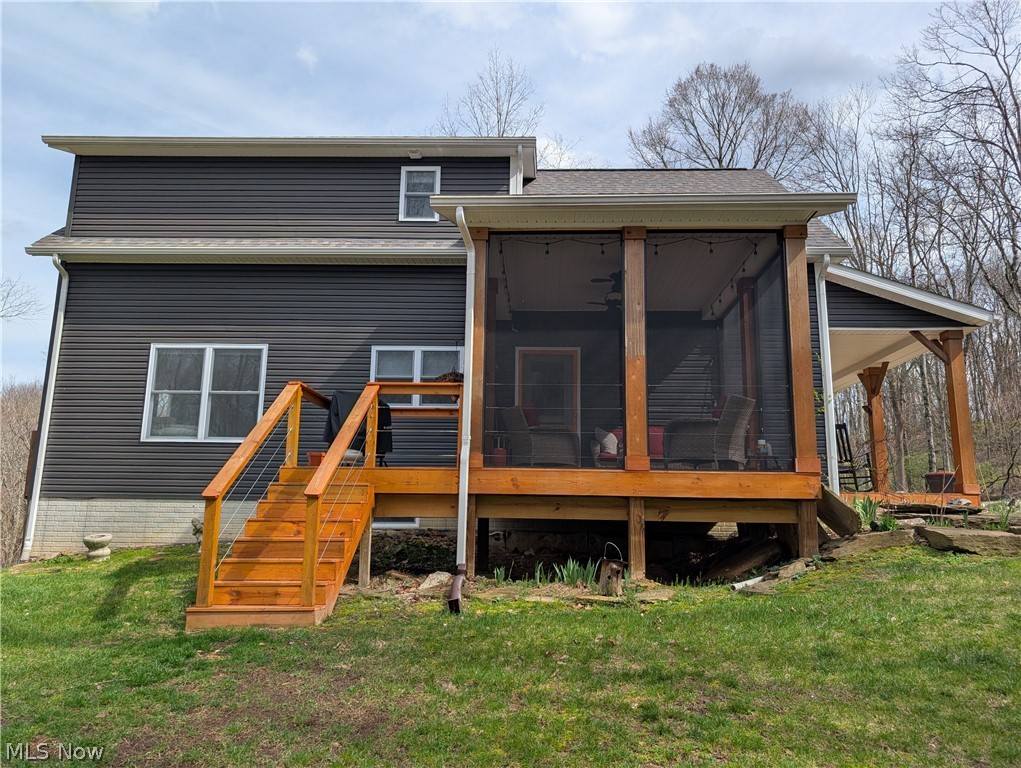 10073 Dunlap Road Cambridge, OH 43725 - Photo 6 of 49 Side of the home with covered and enclosed porch. A perfect place for your grill.