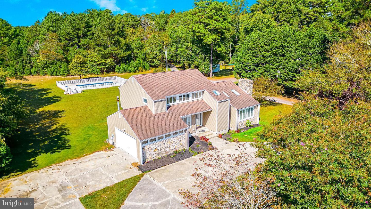 15250 Hudson Road Milton, DE 19968 - Photo 4 of 64 an aerial view of a house with a garden