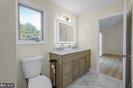 15250 Hudson Road Milton, DE 19968 - Photo 41 of 64 a bathroom with a sink toilet and mirror