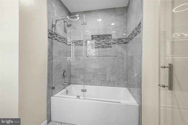 15250 Hudson Road Milton, DE 19968 - Photo 43 of 64 a bathroom with a bathtub and a shower