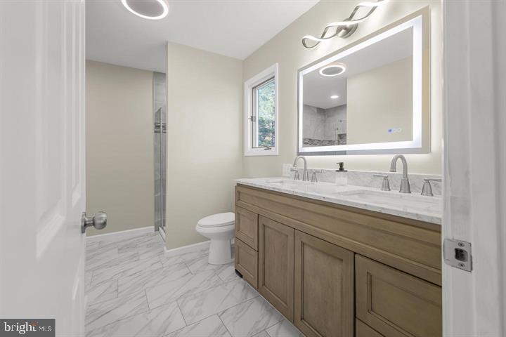 15250 Hudson Road Milton, DE 19968 - Photo 44 of 64 a bathroom with a granite countertop sink toilet and mirror