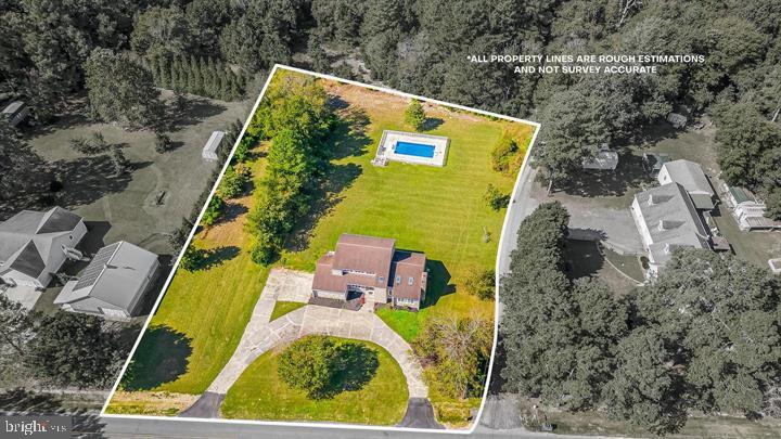 15250 Hudson Road Milton, DE 19968 - Photo 55 of 64 an aerial view of a house with swimming pool