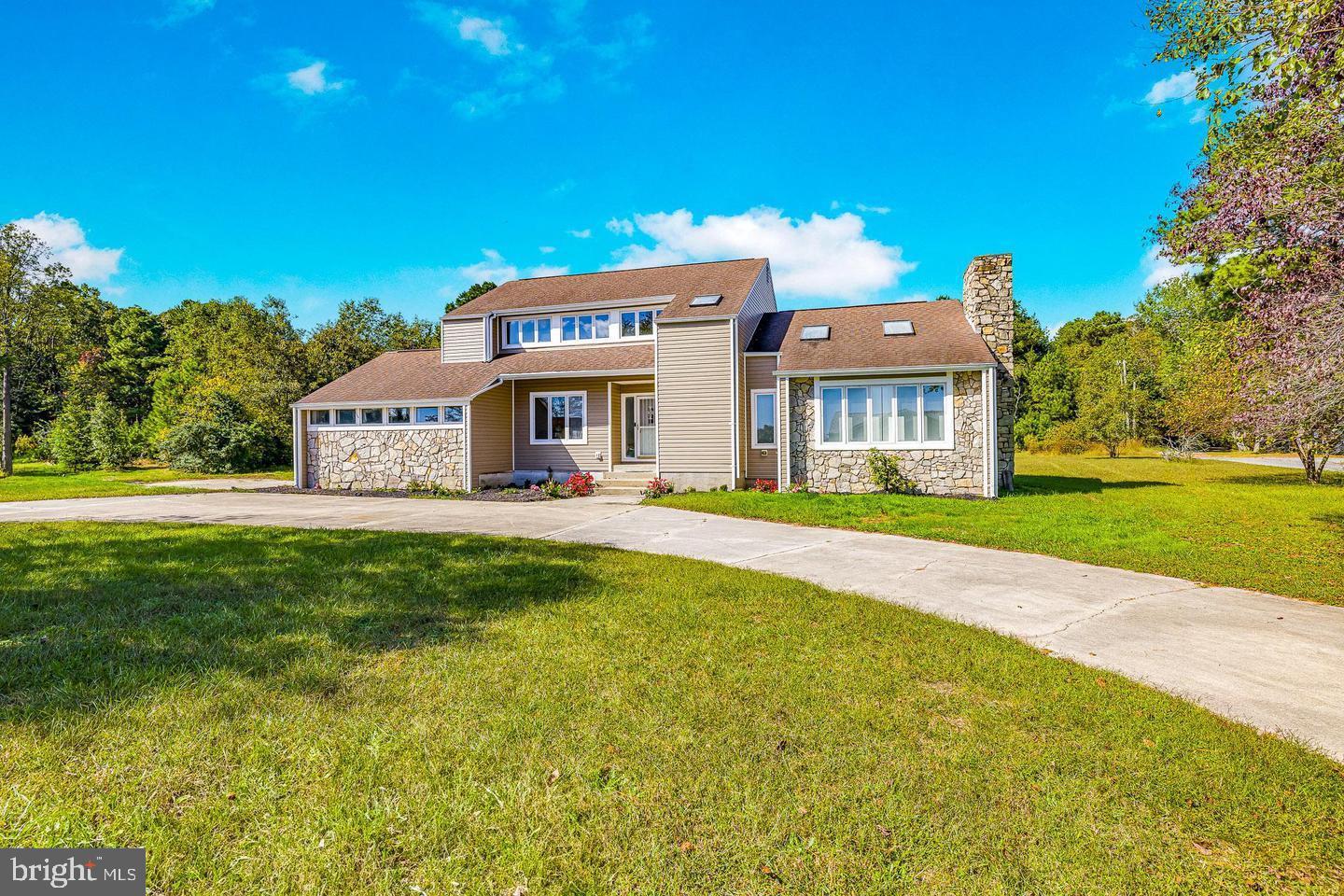 15250 Hudson Road Milton, DE 19968 - Photo 6 of 64 a front view of a house with a yard