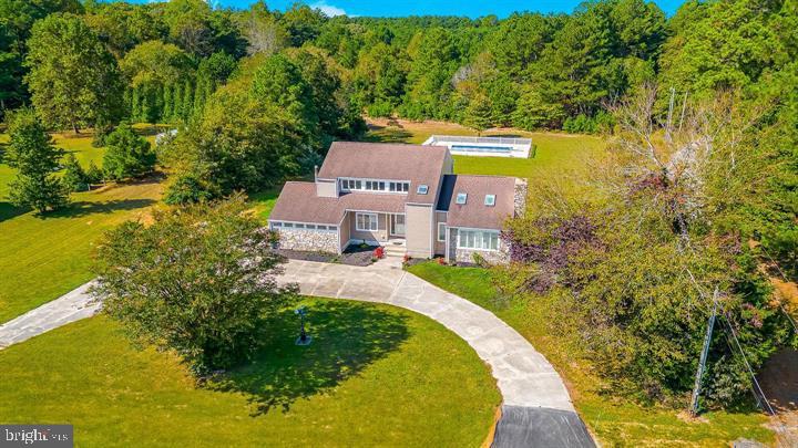 15250 Hudson Road Milton, DE 19968 - Photo 63 of 64 an aerial view of a house with swimming pool and garden