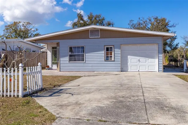 a front view of a house with a garage