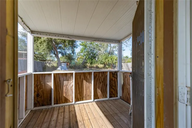 a view of a balcony with wooden floor