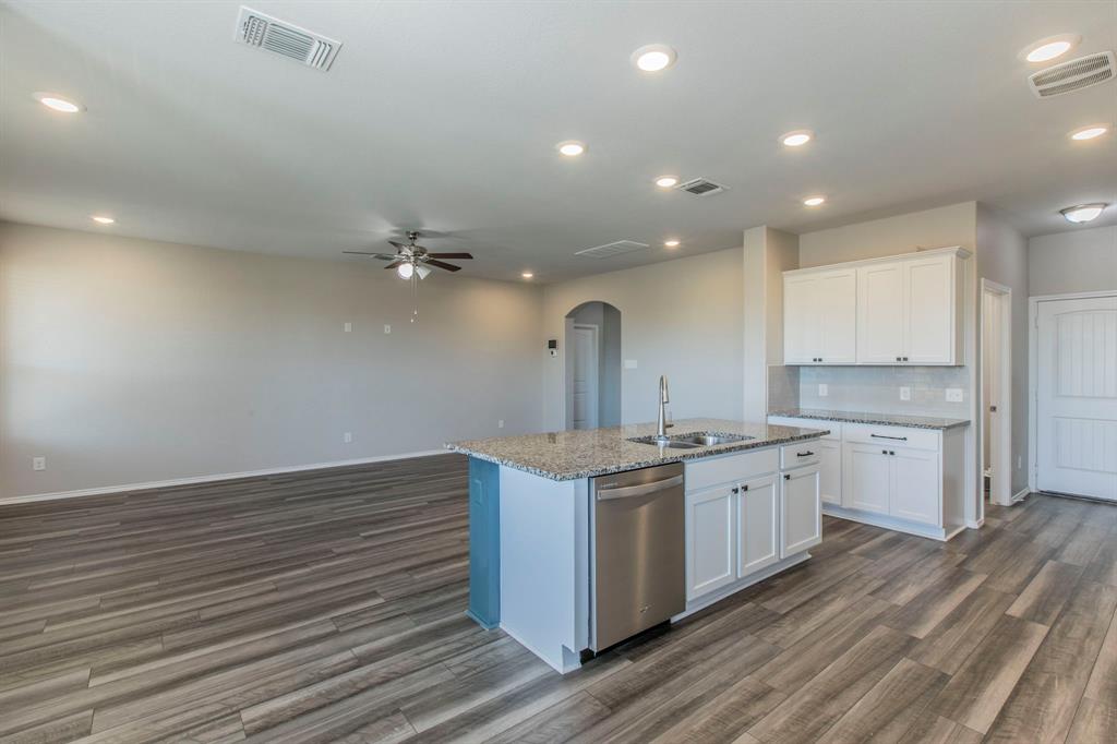 6401 Elephant Butte Drive Waco, TX 76708 - Photo 34 of 34 a kitchen with stainless steel appliances granite countertop a sink stove and refrigerator