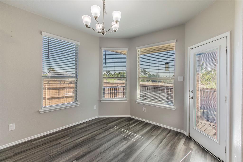 6401 Elephant Butte Drive Waco, TX 76708 - Photo 10 of 34 a view of an empty room with a window and wooden floor
