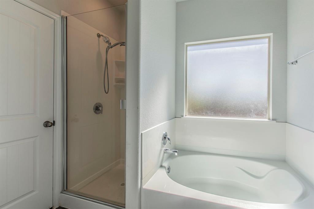 6401 Elephant Butte Drive Waco, TX 76708 - Photo 15 of 34 a white bath tub sitting next to a shower
