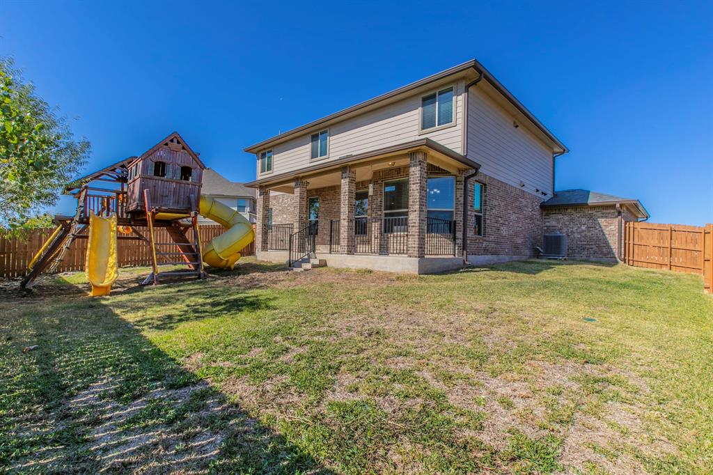 6401 Elephant Butte Drive Waco, TX 76708 - Photo 29 of 34 a view of a house with a backyard