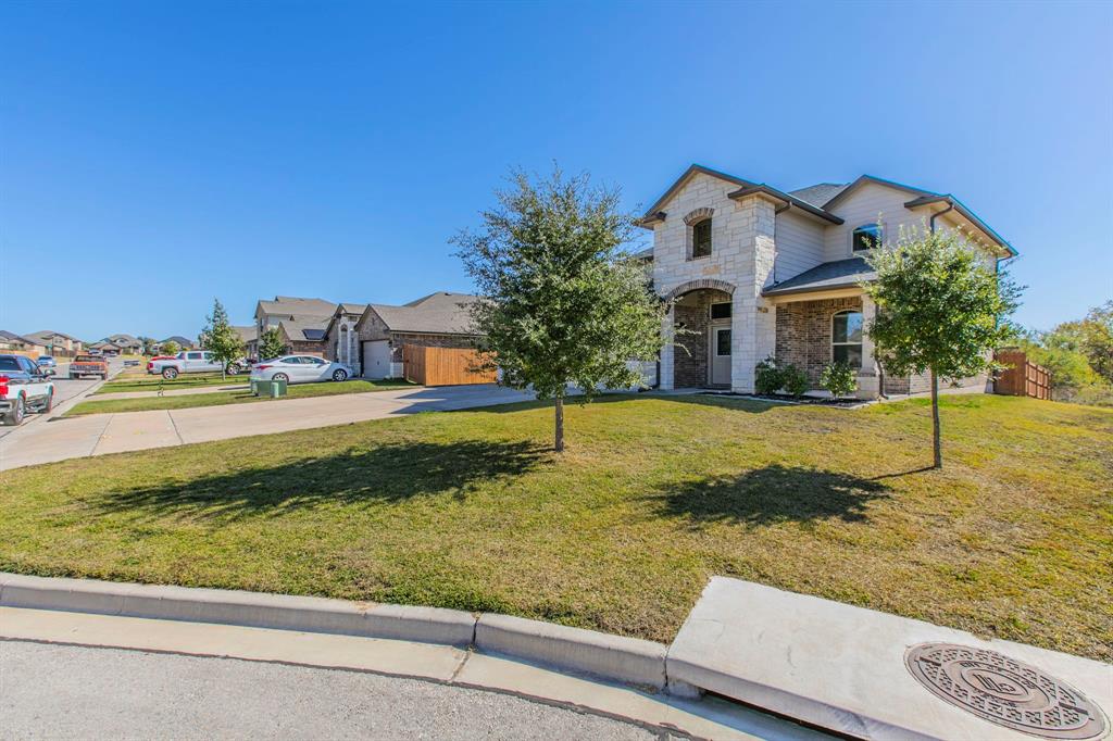 6401 Elephant Butte Drive Waco, TX 76708 - Photo 4 of 34 a view of a house with a yard