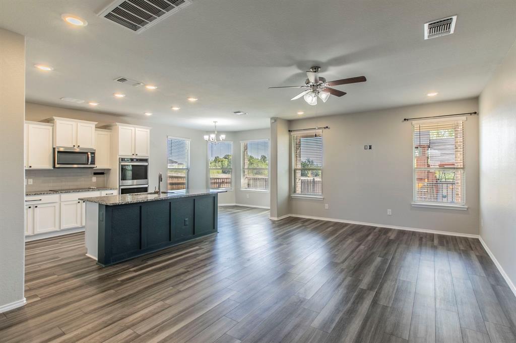 6401 Elephant Butte Drive Waco, TX 76708 - Photo 31 of 34 an open kitchen with wooden floors and kitchen view
