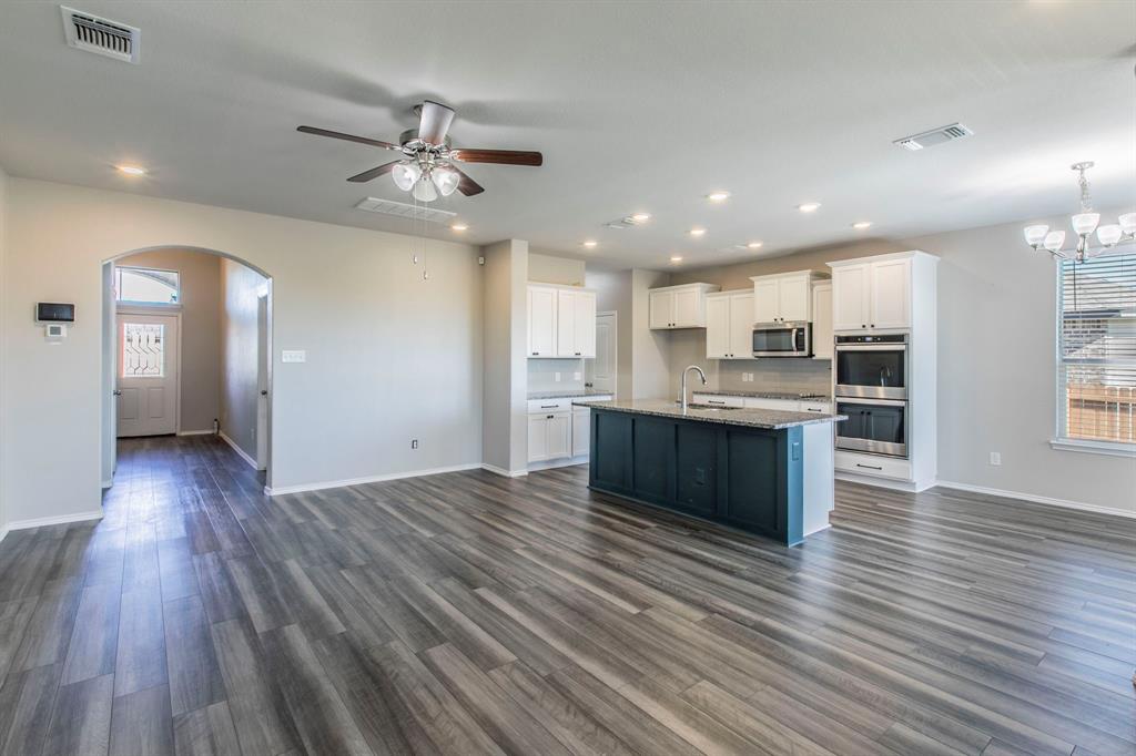 6401 Elephant Butte Drive Waco, TX 76708 - Photo 32 of 34 a view of kitchen with cabinets and wooden floor