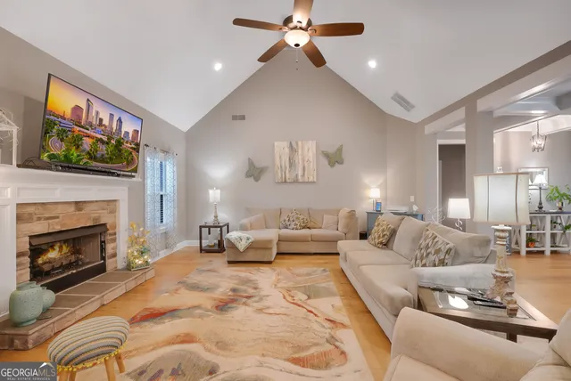 a living room with furniture and a fireplace