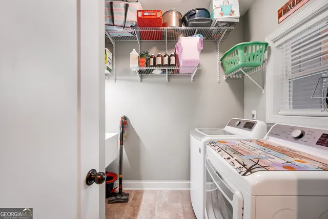 a utility room with dryer and washer