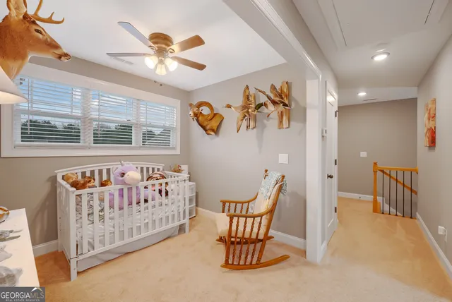 a bed room with a bed and a chair