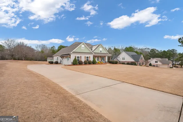 a view of house with outdoor space and street view