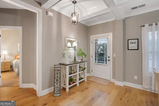 a view of a livingroom with a furniture hardwood floor and a ceiling fan