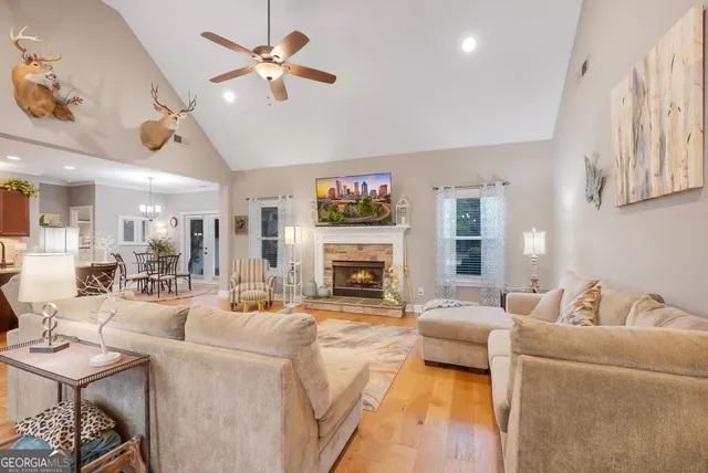 a living room with furniture fireplace and a flat screen tv
