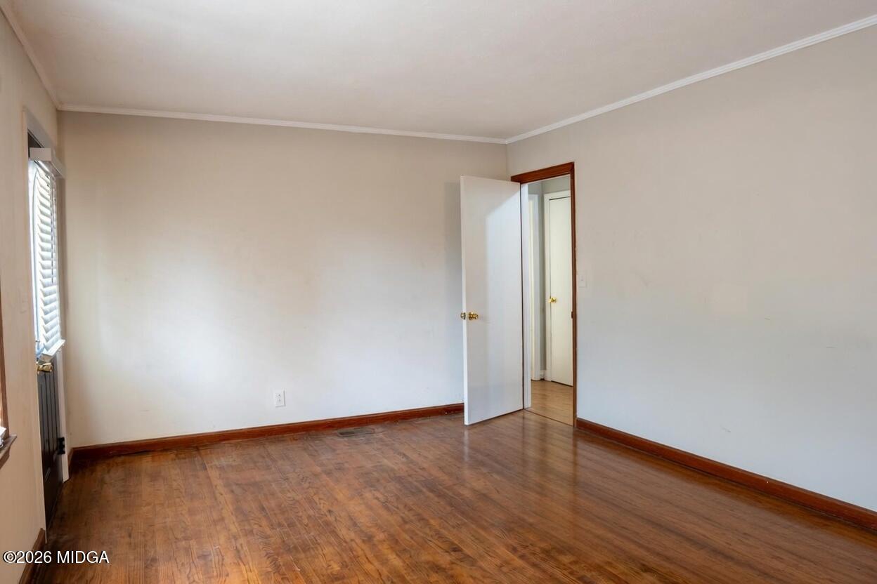 3319 Mohawk Road Macon, GA 31217 - Photo 12 of 38 a view of an empty room with wooden floor and closet
