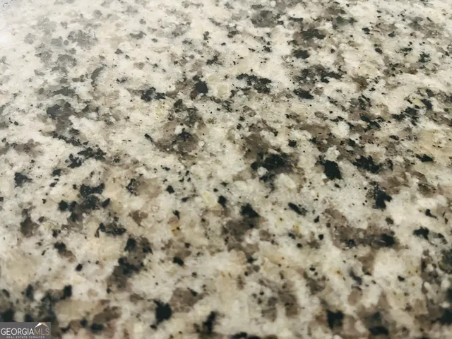 a close up of a white marble wall