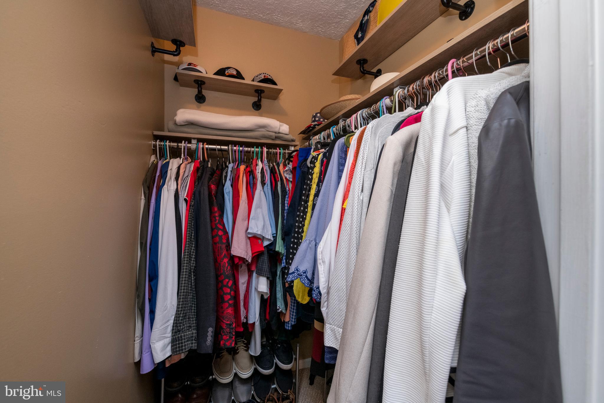 5014 Tartan Hill Road Perry Hall, MD 21128 - Photo 22 of 43 a view of walk in closet with clothes