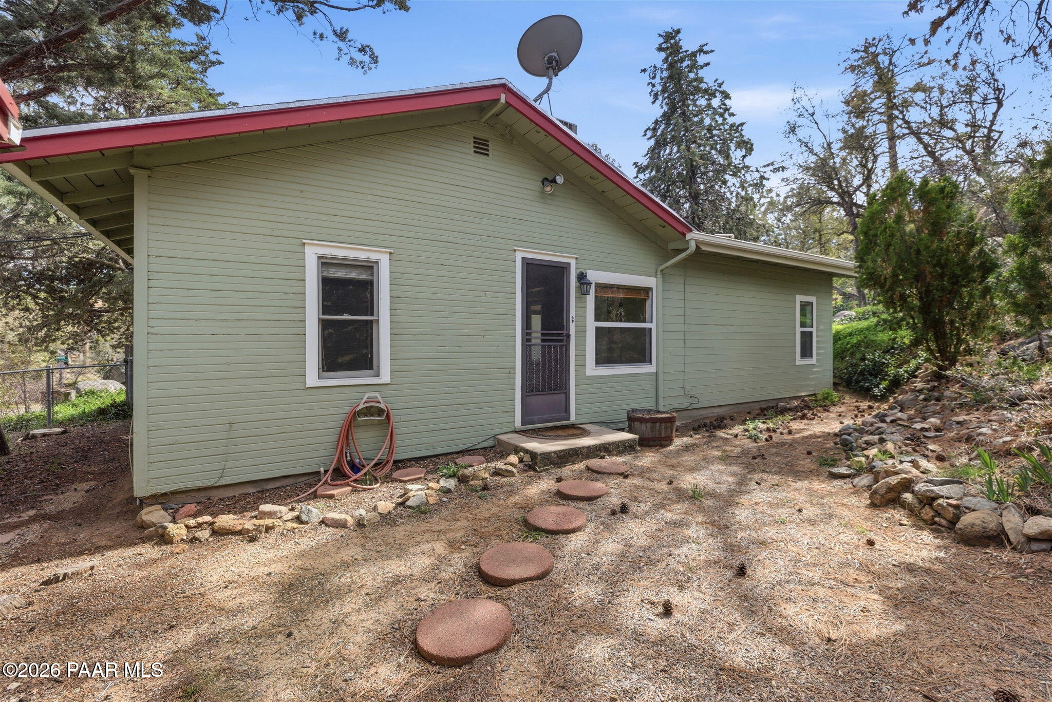 1701 Idylwild Road Prescott, AZ 86305 - Photo 14 of 26 a backyard of a house with table and chairs