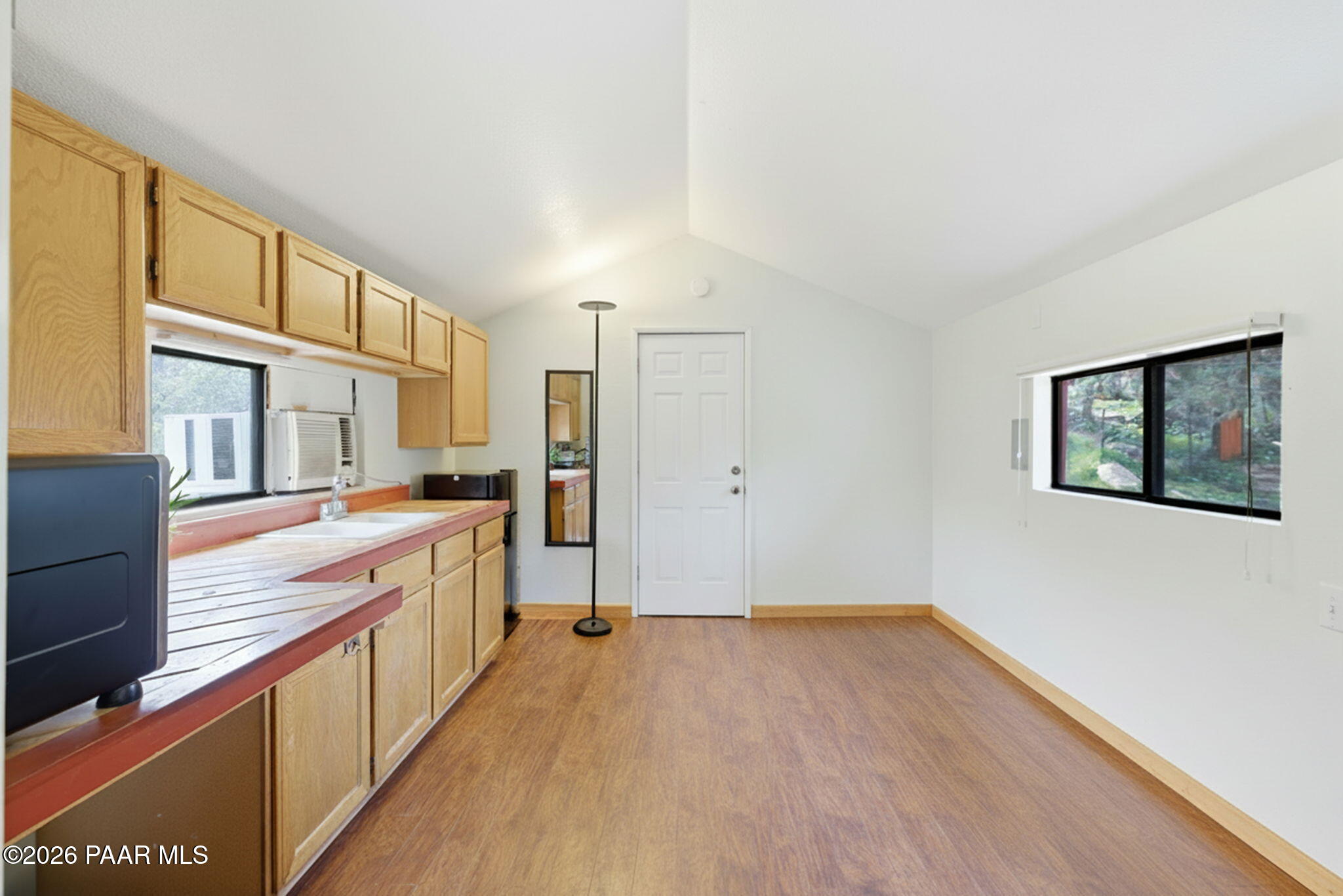 1701 Idylwild Road Prescott, AZ 86305 - Photo 20 of 26 a view of a kitchen with wooden floor and a window