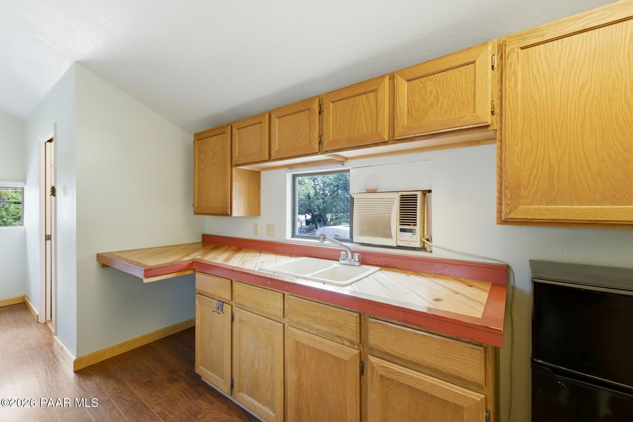 1701 Idylwild Road Prescott, AZ 86305 - Photo 22 of 26 a kitchen with a sink and cabinets