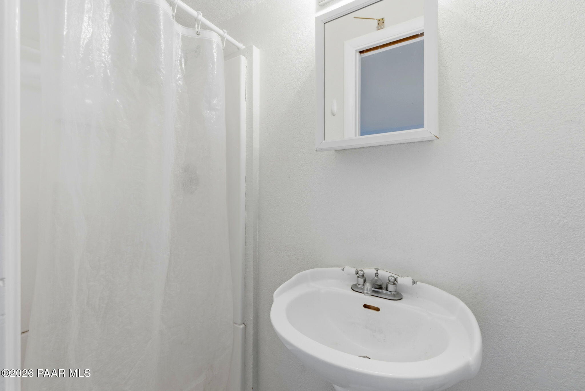 1701 Idylwild Road Prescott, AZ 86305 - Photo 23 of 26 a bathroom with a sink and a mirror