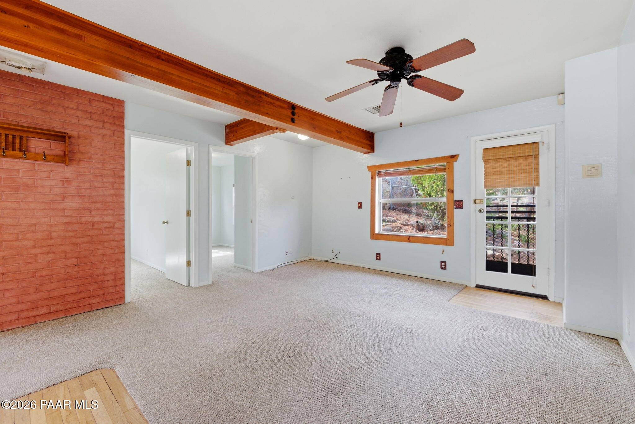 1701 Idylwild Road Prescott, AZ 86305 - Photo 5 of 26 a view of an empty room with a ceiling fan
