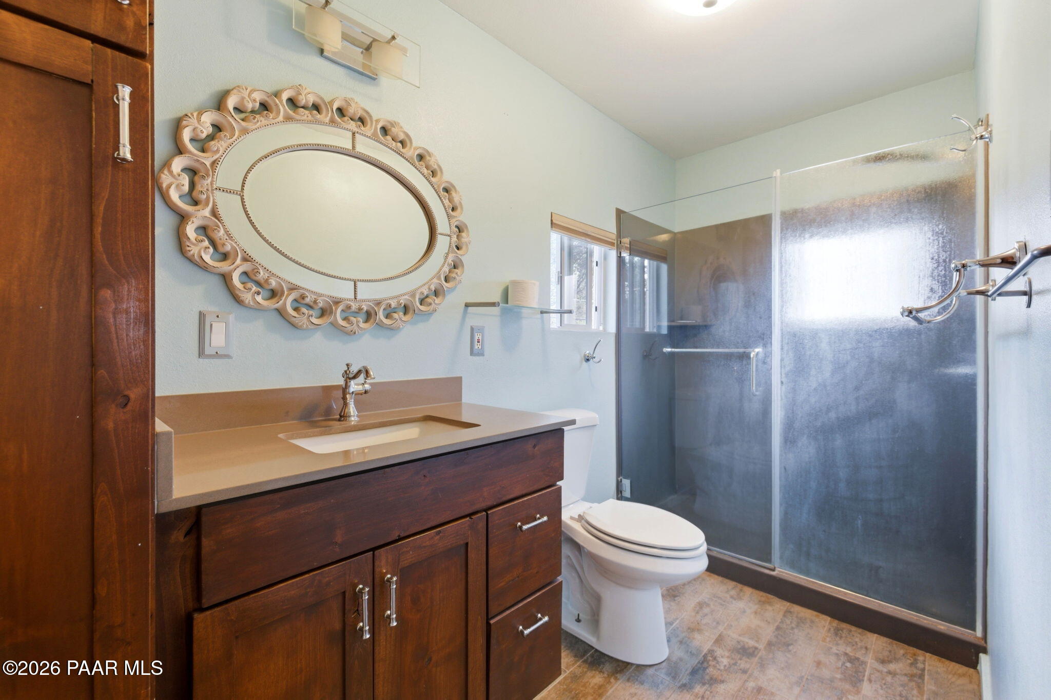 1701 Idylwild Road Prescott, AZ 86305 - Photo 9 of 26 a bathroom with a toilet a sink a mirror and a shower