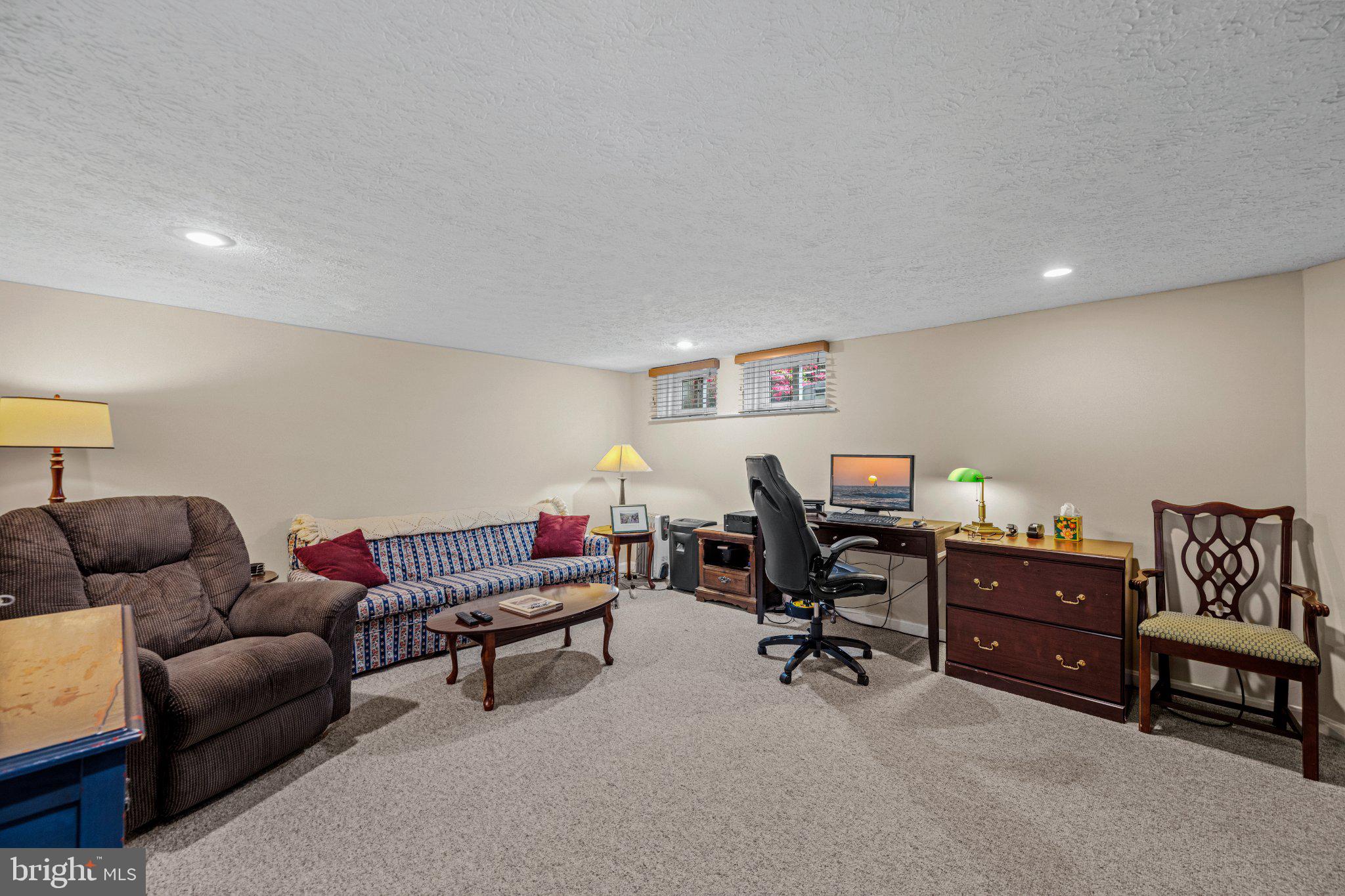 406 Greenlow Road Baltimore, MD 21228 - Photo 25 of 31 Cozy basement retreat for relaxation.