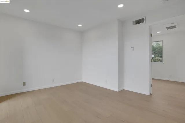 a living room with furniture a fireplace and a view