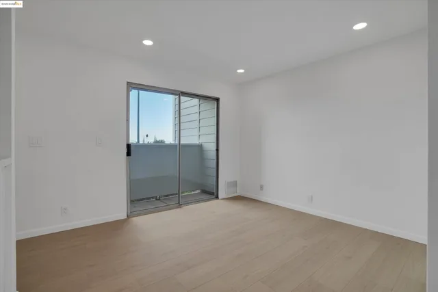 a kitchen with a refrigerator and a sink