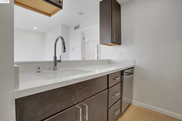 a stove top oven sitting inside of a kitchen