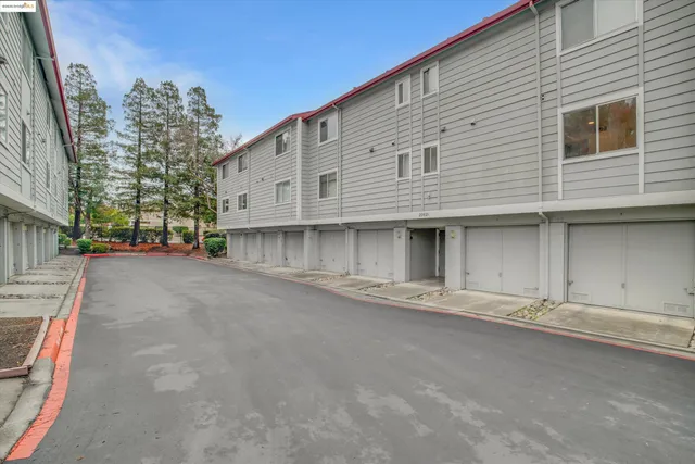 a view of a building with a yard