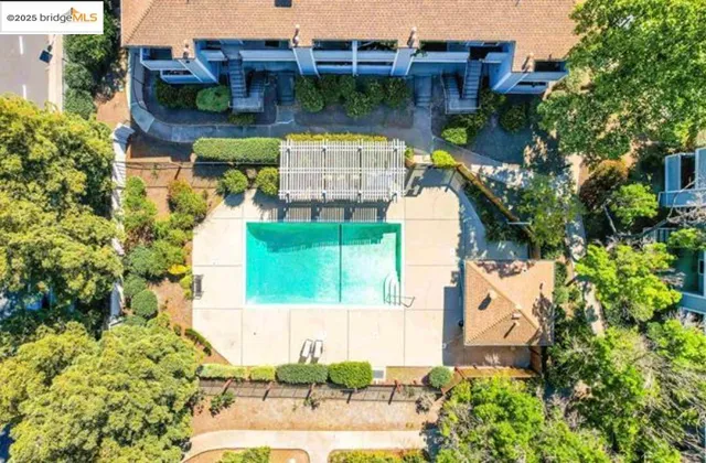 an aerial view of a house with swimming pool