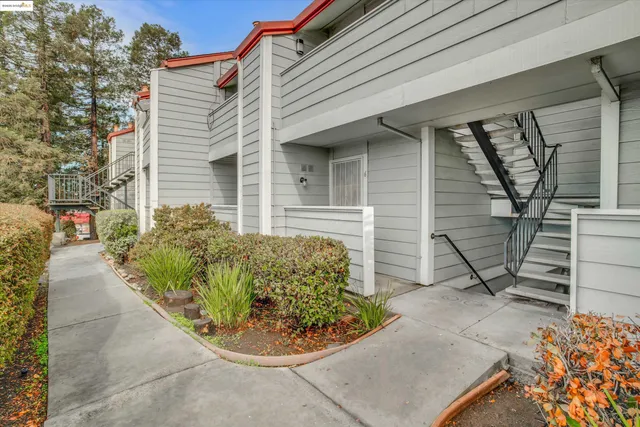 a view of staircase with white walls