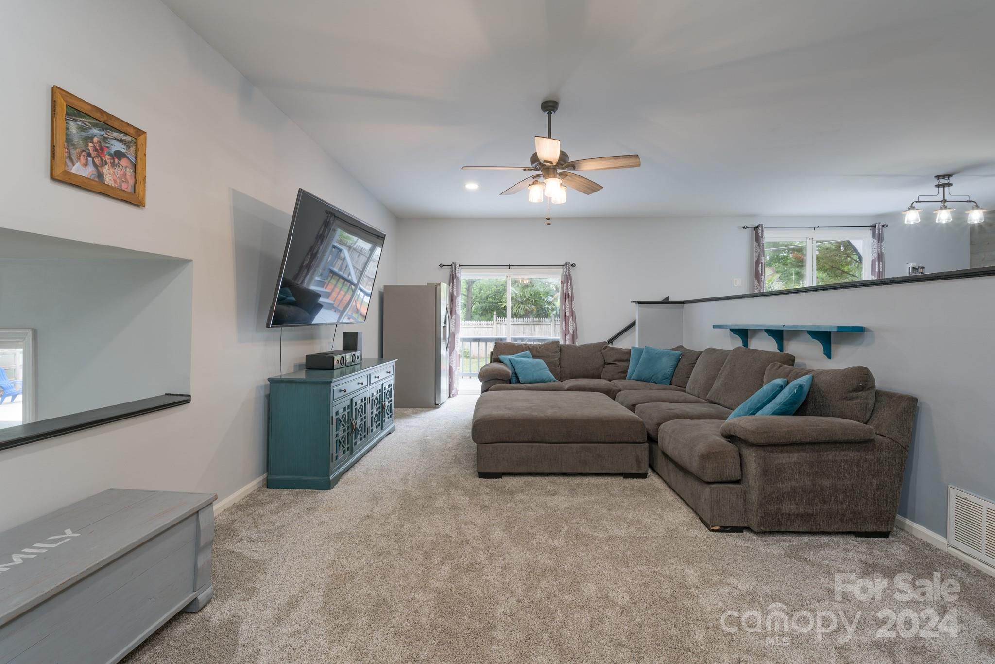 4093 Marquesas Avenue Tega Cay, SC 29708 - Photo 14 of 38 a living room with furniture and a flat screen tv
