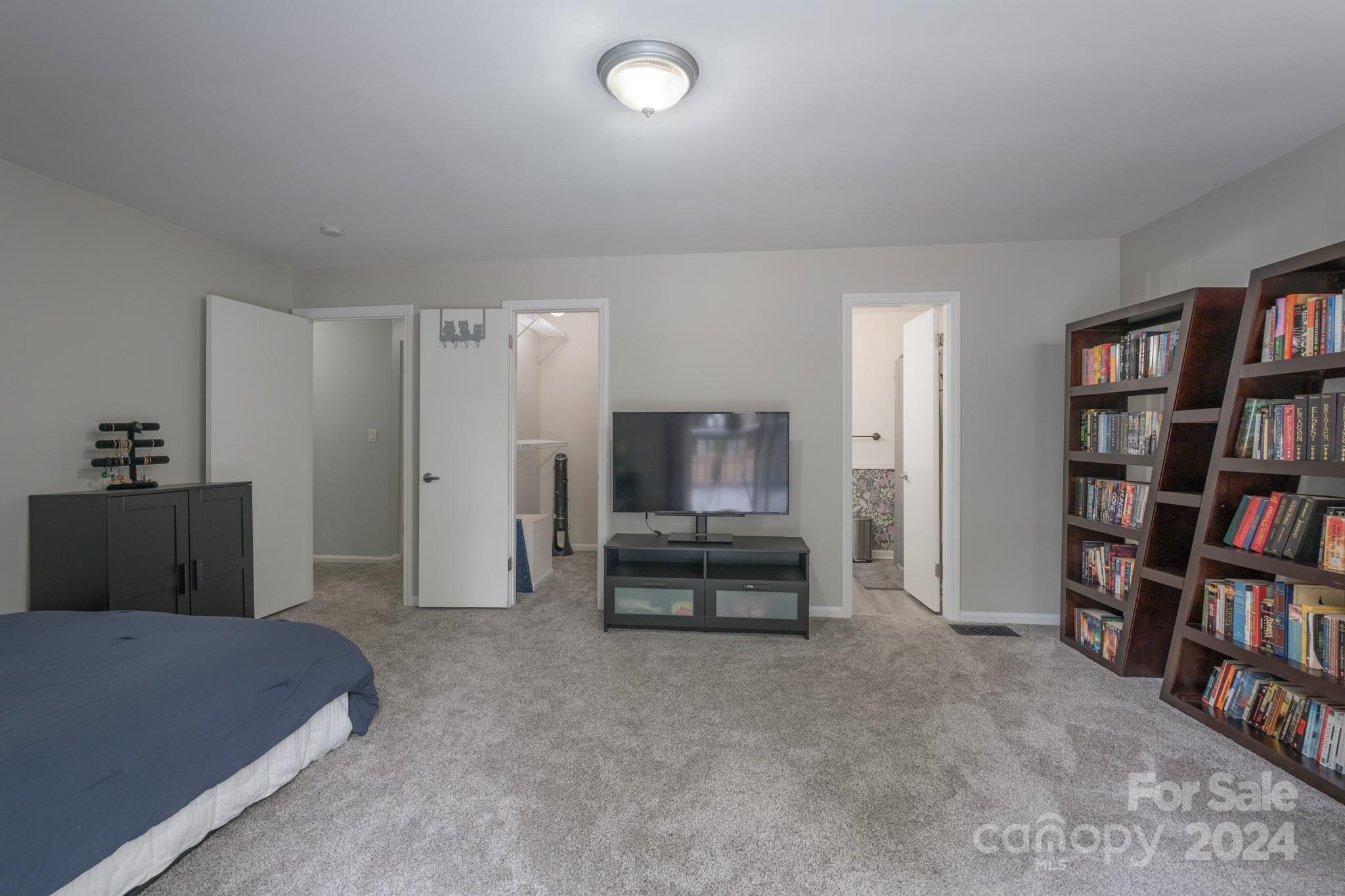 4093 Marquesas Avenue Tega Cay, SC 29708 - Photo 17 of 38 a living room with furniture and a book shelf