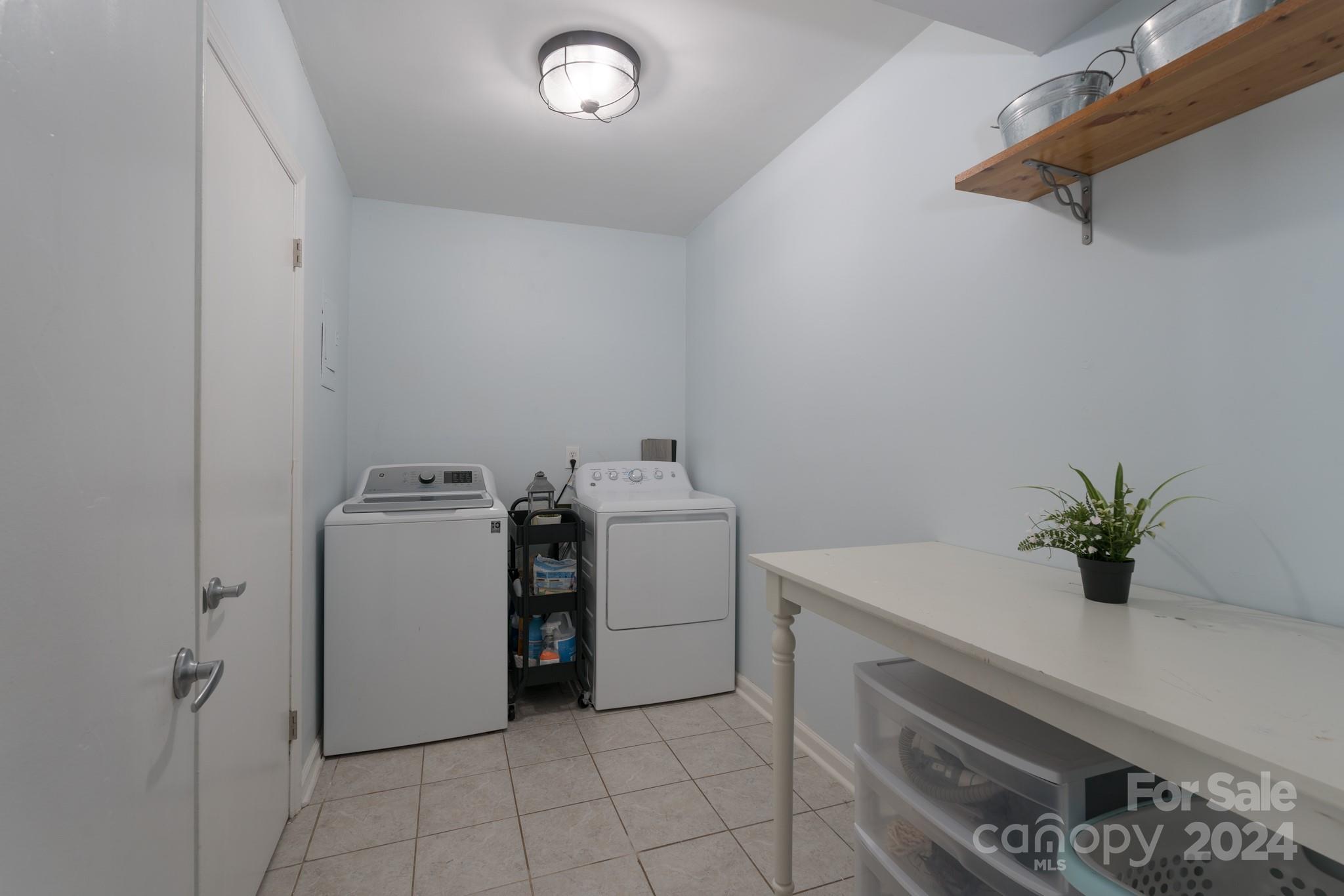 4093 Marquesas Avenue Tega Cay, SC 29708 - Photo 27 of 38 a utility room with dryer and washer