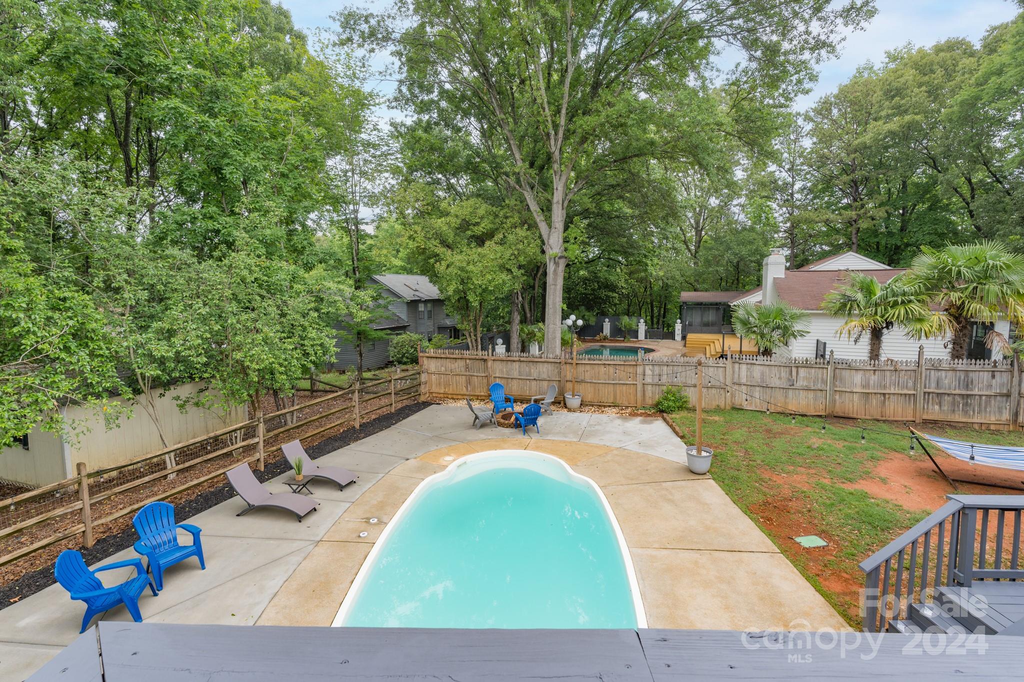 4093 Marquesas Avenue Tega Cay, SC 29708 - Photo 31 of 38 a view of a swimming pool with chairs