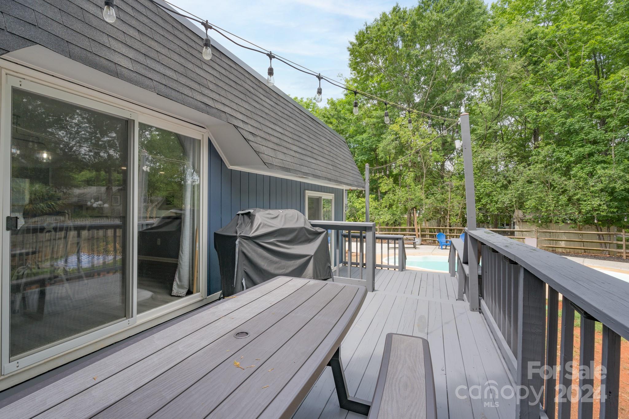 4093 Marquesas Avenue Tega Cay, SC 29708 - Photo 34 of 38 a view of house with deck and outdoor seating
