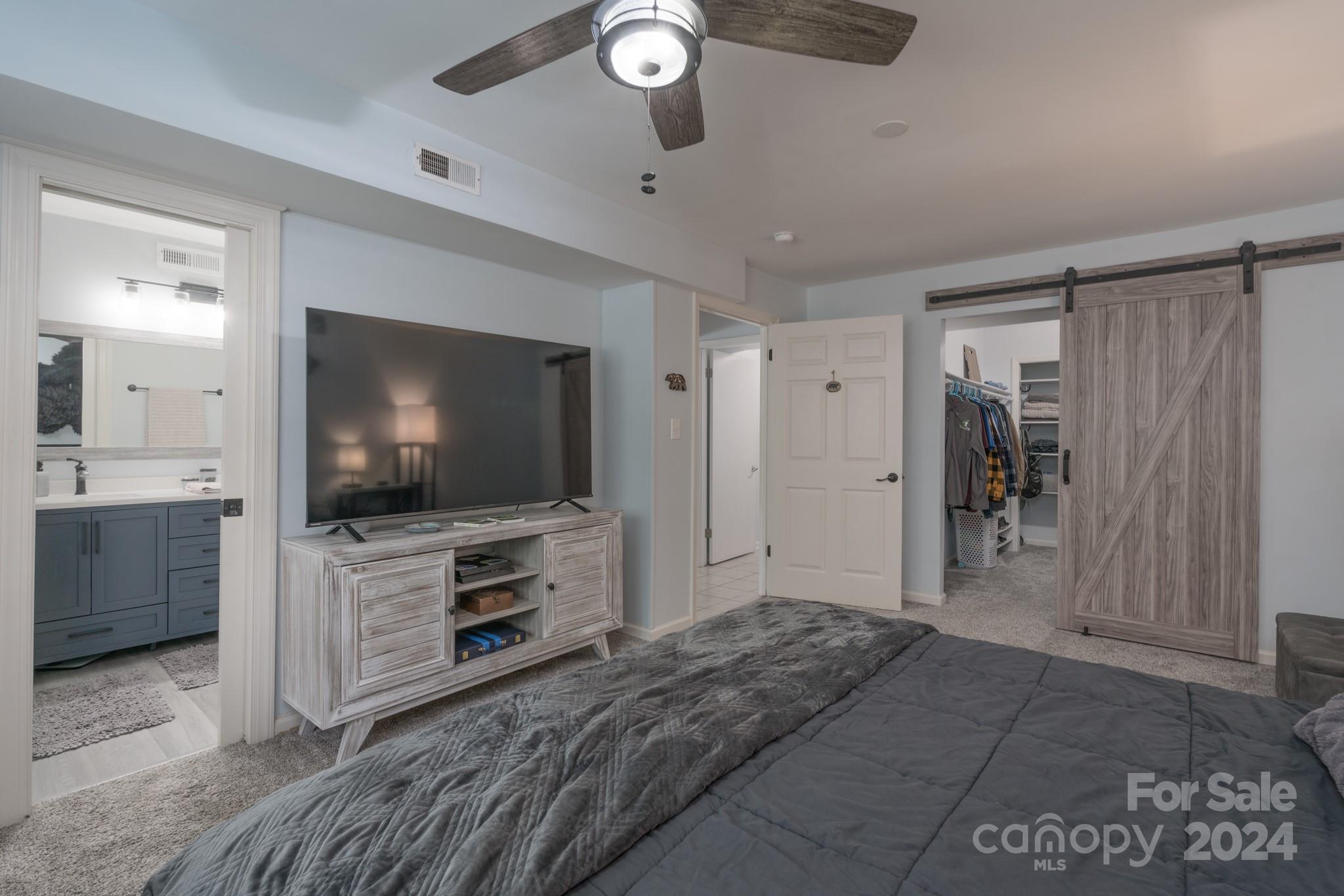 4093 Marquesas Avenue Tega Cay, SC 29708 - Photo 4 of 38 a bedroom with furniture and a flat screen tv
