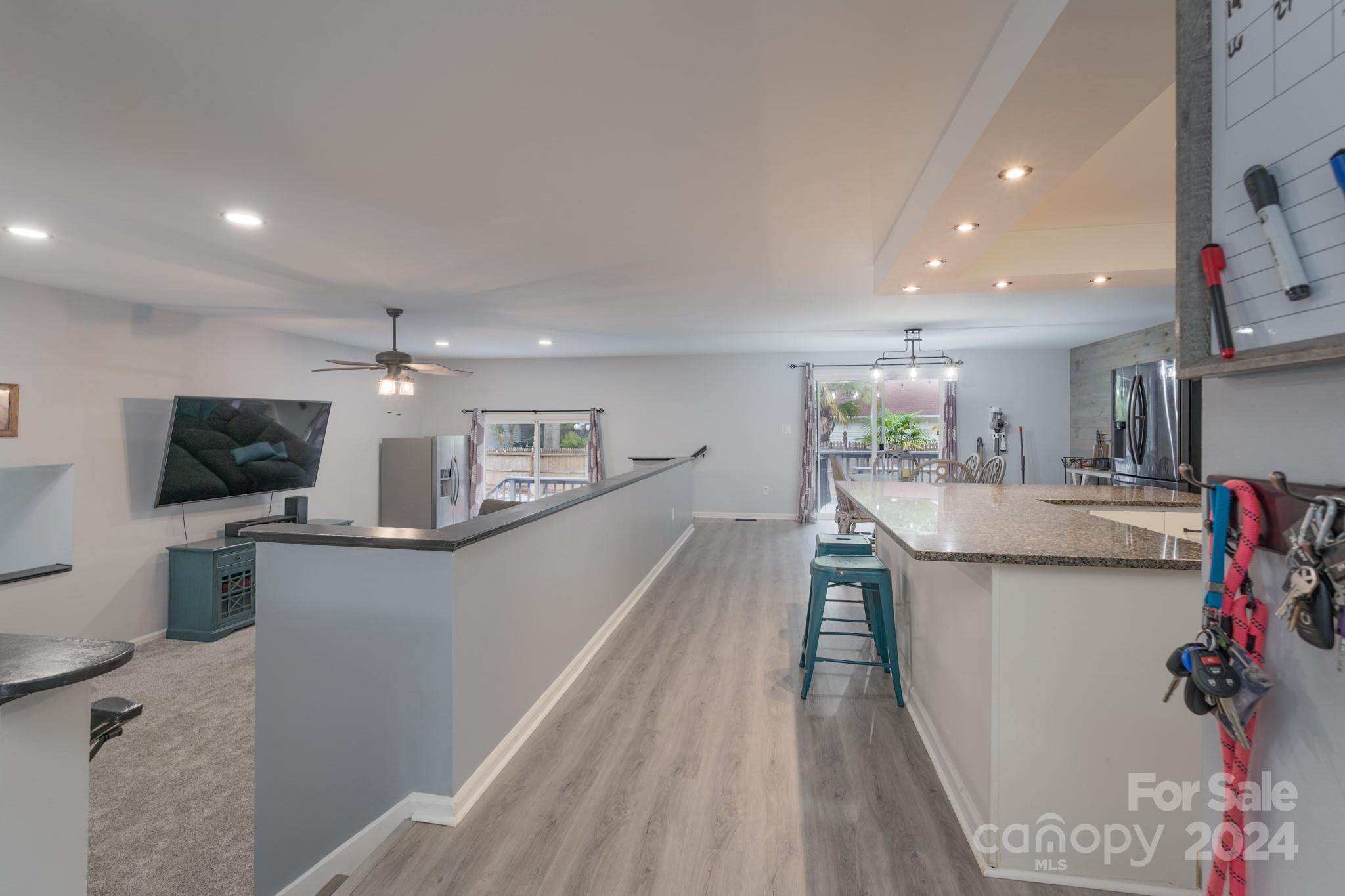 4093 Marquesas Avenue Tega Cay, SC 29708 - Photo 7 of 38 a view of a living room and a wooden floor